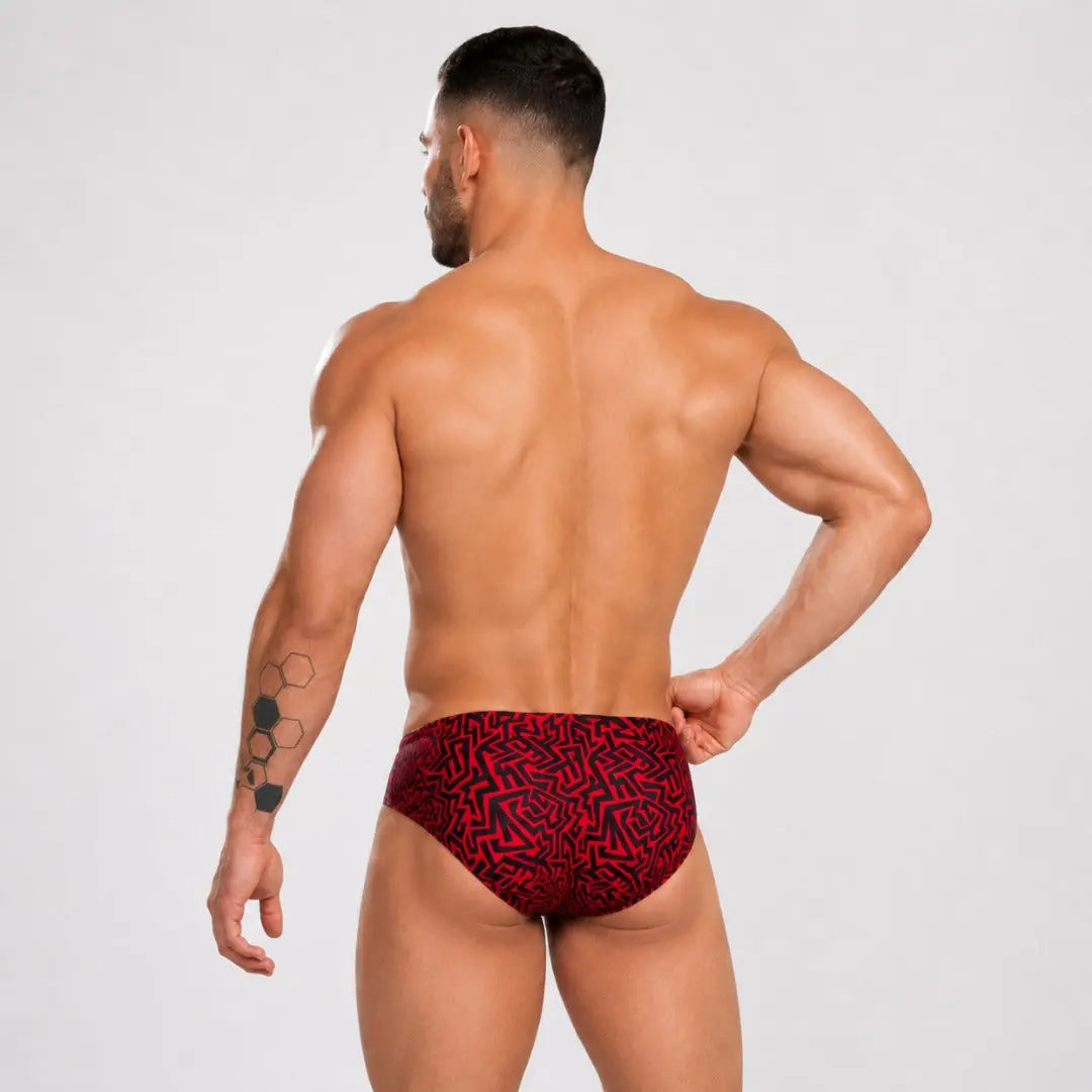 Men's swim briefs, back view with red Grecas print by Equal Swimwear.
